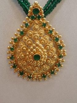 11. Beautiful locket with green stones and chain